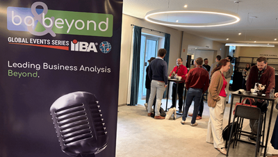 Ba & Beyond banner at the venue with people talking in the background