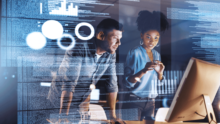 Man and woman in front of a screen working on Process Mining